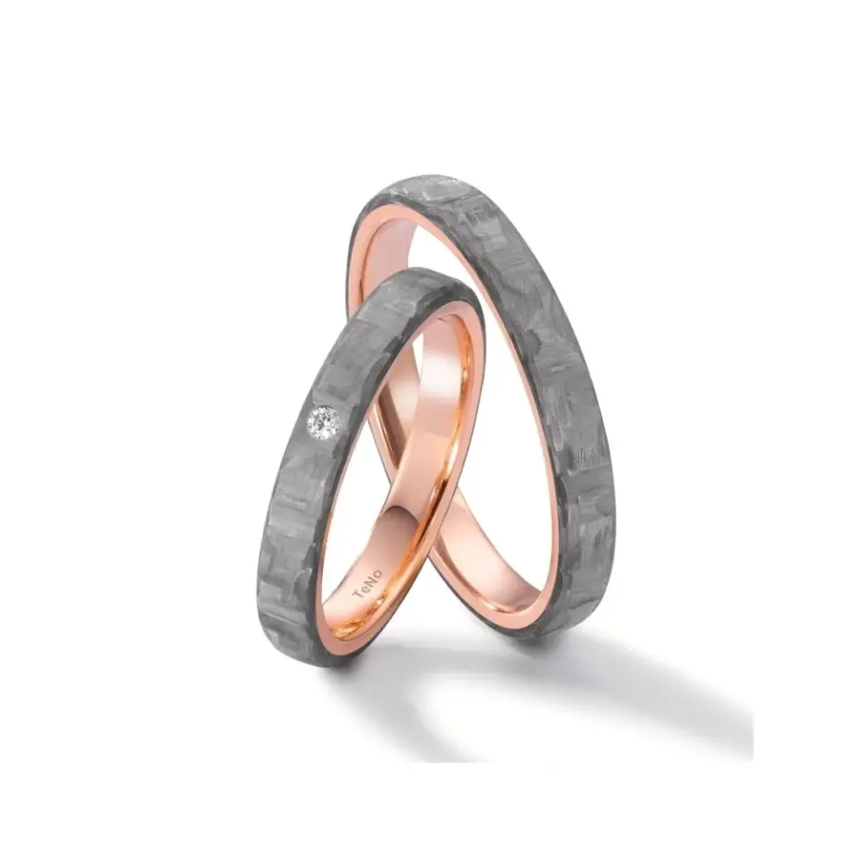 Alianzas de boda de carbono y oro rosado con diamante