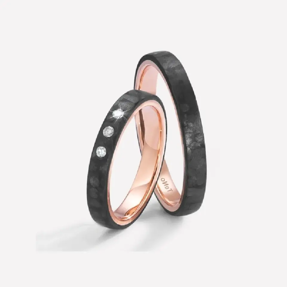 Alianzas de boda de carbono y oro rosado con diamantes