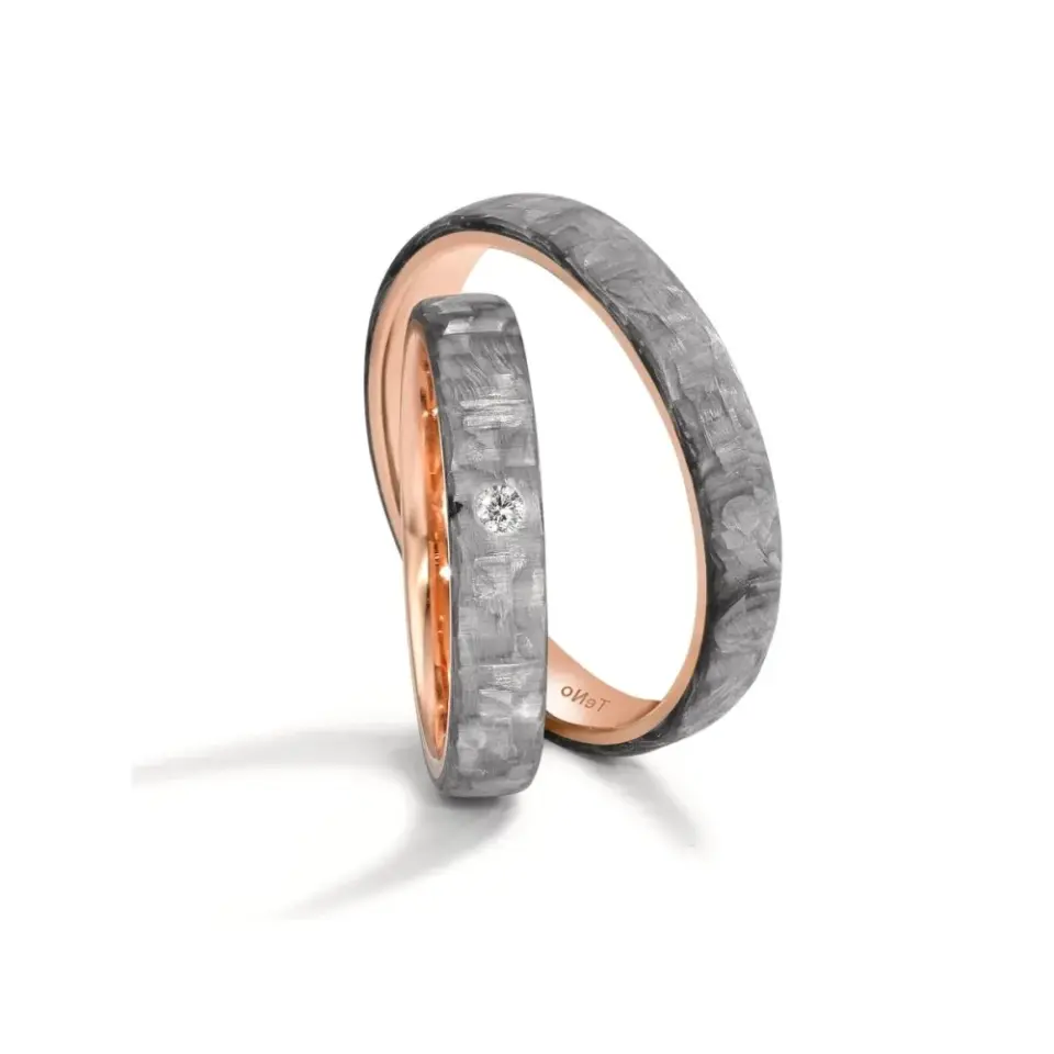 Alianzas de boda de carbono y oro rosado con diamante