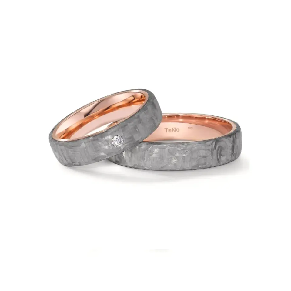 Alianzas de boda de carbono y oro rosado con diamante