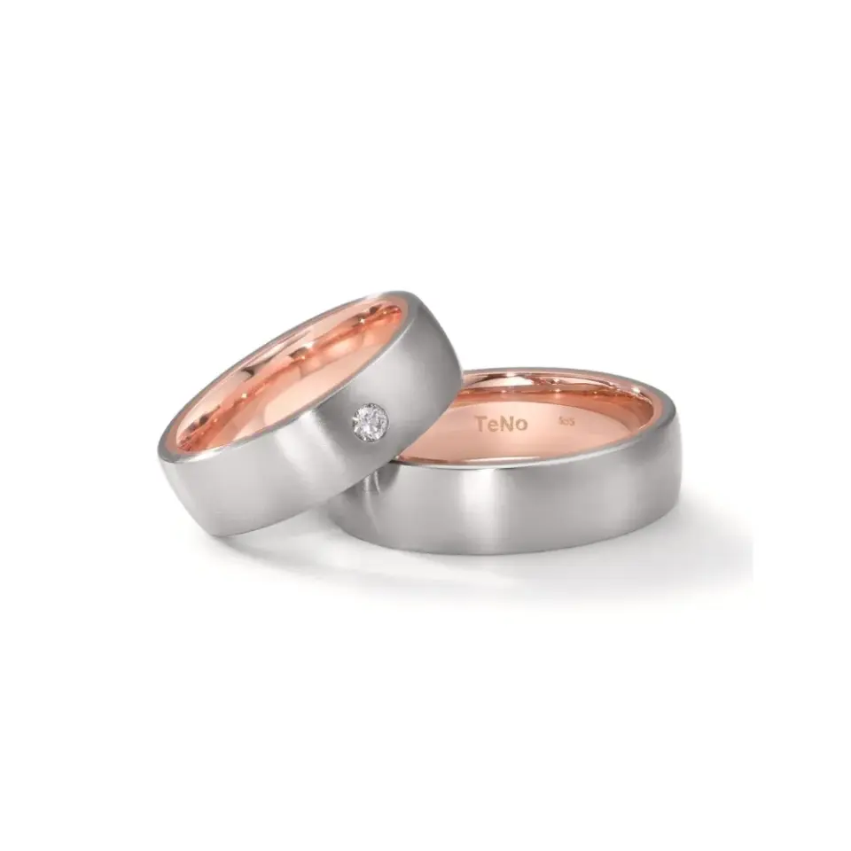 Alianzas de boda de acero y oro rosado con diamante