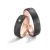 Alianzas de boda de carbono y oro rosado con diamante