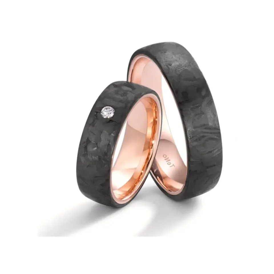 Alianzas de boda de carbono y oro rosado con diamante