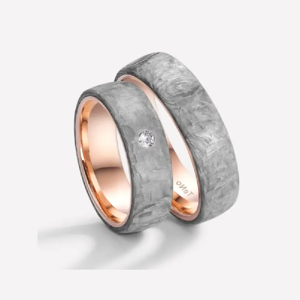 Alianzas de boda de carbono y oro rosado con diamante