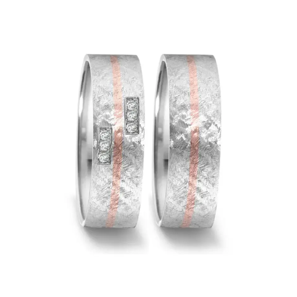 Alianzas de boda de acero y oro rosado con diamantes