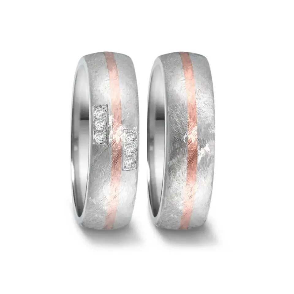 Alianzas de boda de acero y oro rosado con diamantes