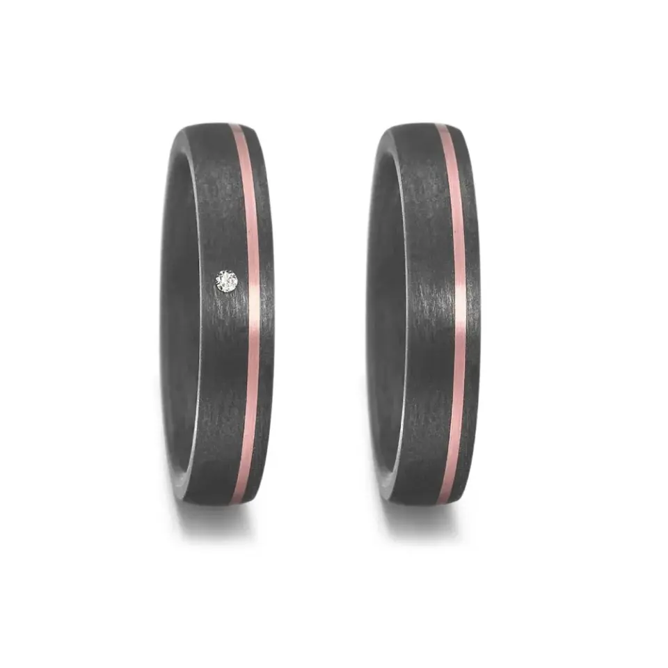 Alianzas de boda de carbono y oro rosado con diamante