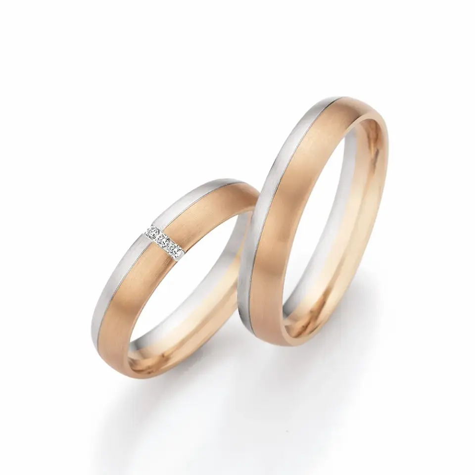 Alianzas de boda de oro champagne y platino con diamantes