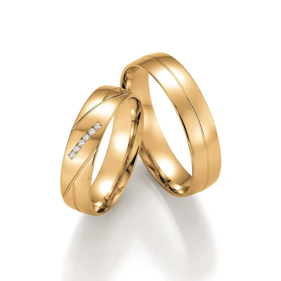 Alianzas de boda de oro amarillo con diamantes