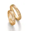 Alianzas de boda de oro amarillo con diamantes