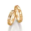 Alianzas de boda de oro amarillo con diamantes