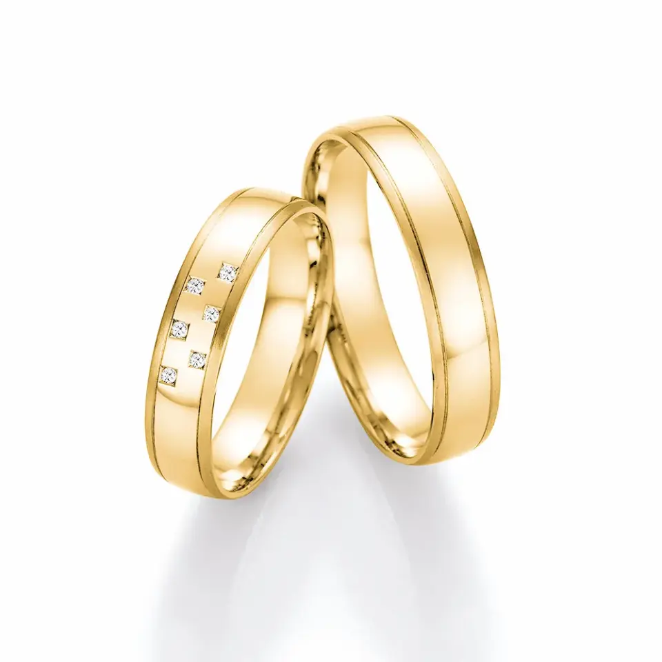 Alianzas de boda de oro amarillo con diamantes