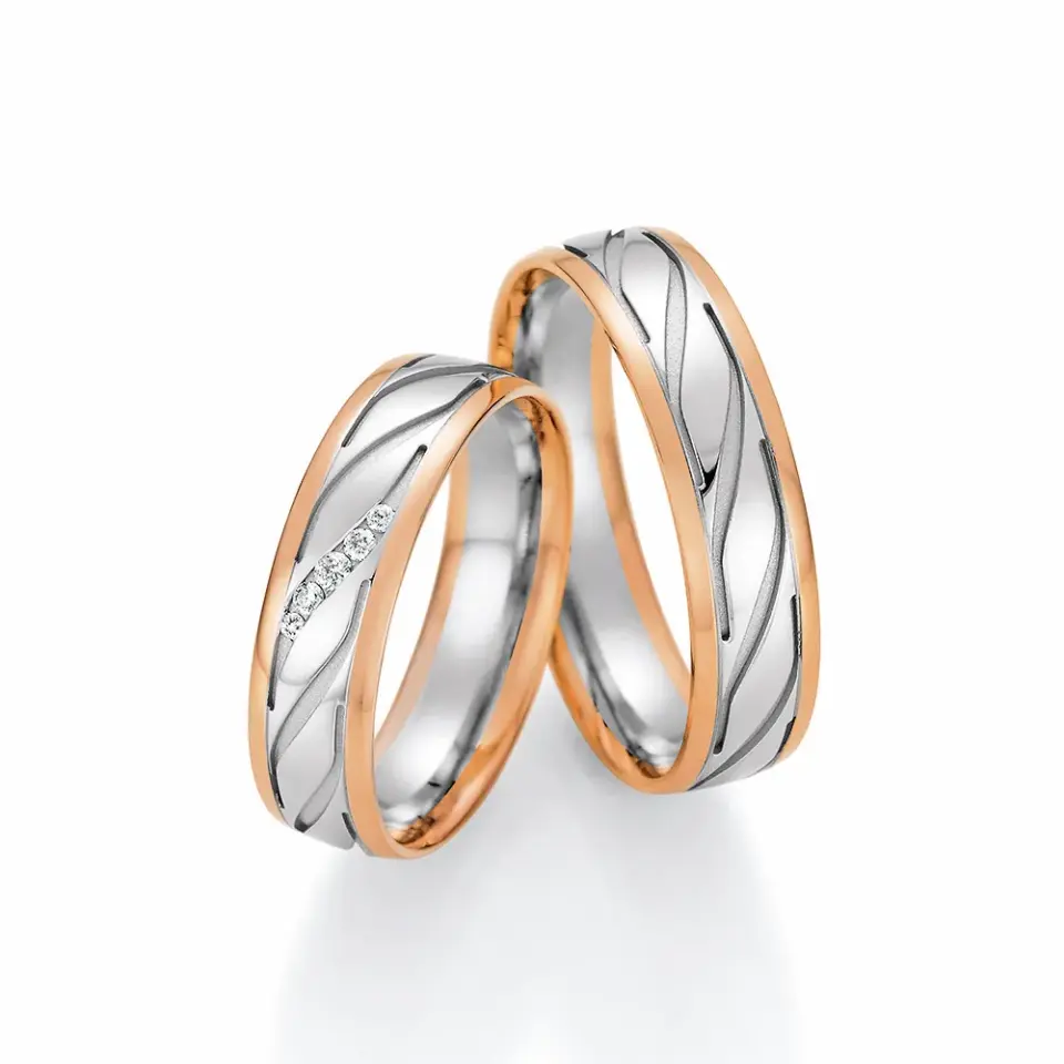 Alianzas de boda de oro rosado y platino con diamantes