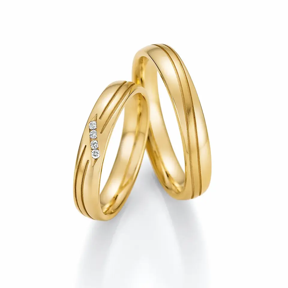 Alianzas de boda de oro amarillo con diamantes