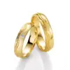 Alianzas de boda de oro amarillo con diamante