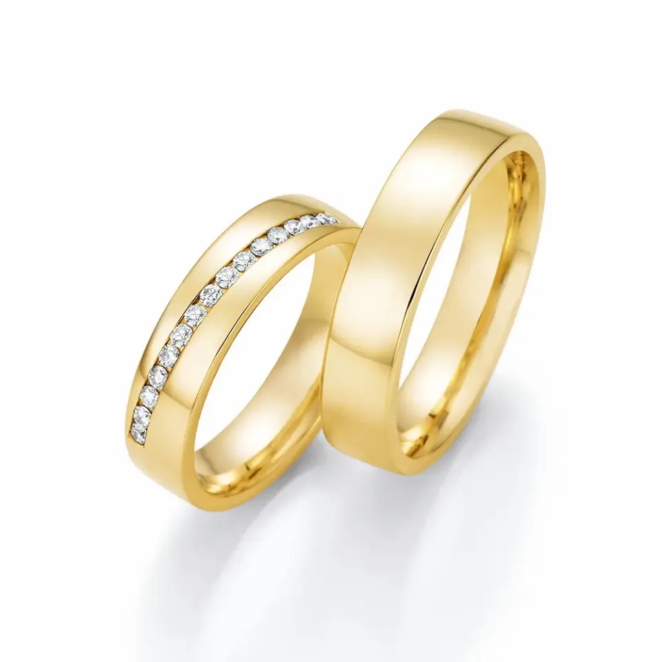 Alianzas de boda de oro amarillo con diamantes