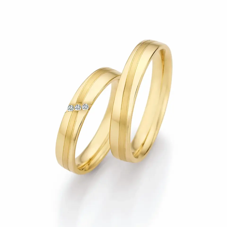 Alianzas de boda de oro amarillo con diamantes
