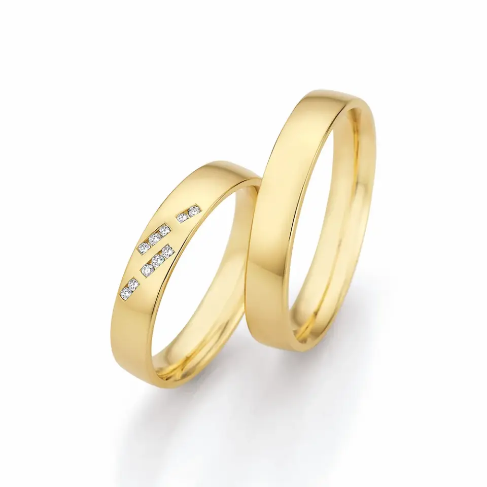 Alianzas de boda de oro amarillo con diamantes