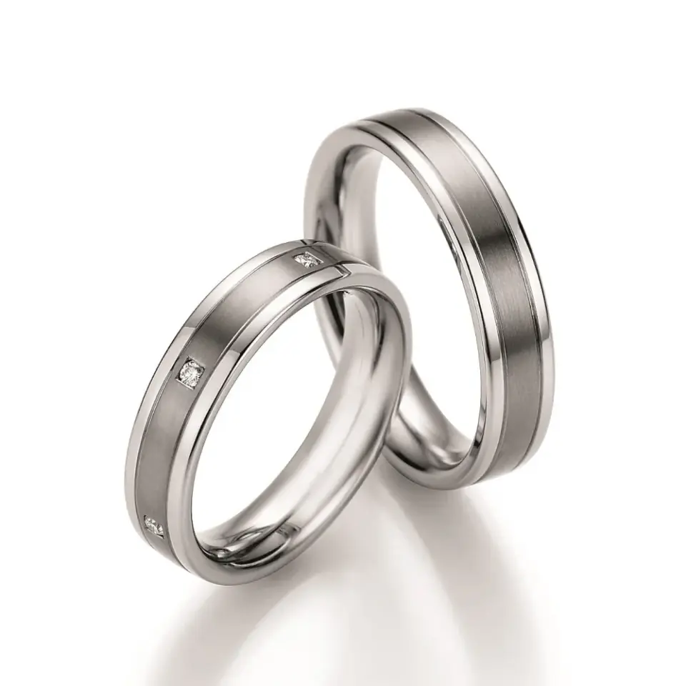 Alianzas de boda de acero y titanio con diamantes