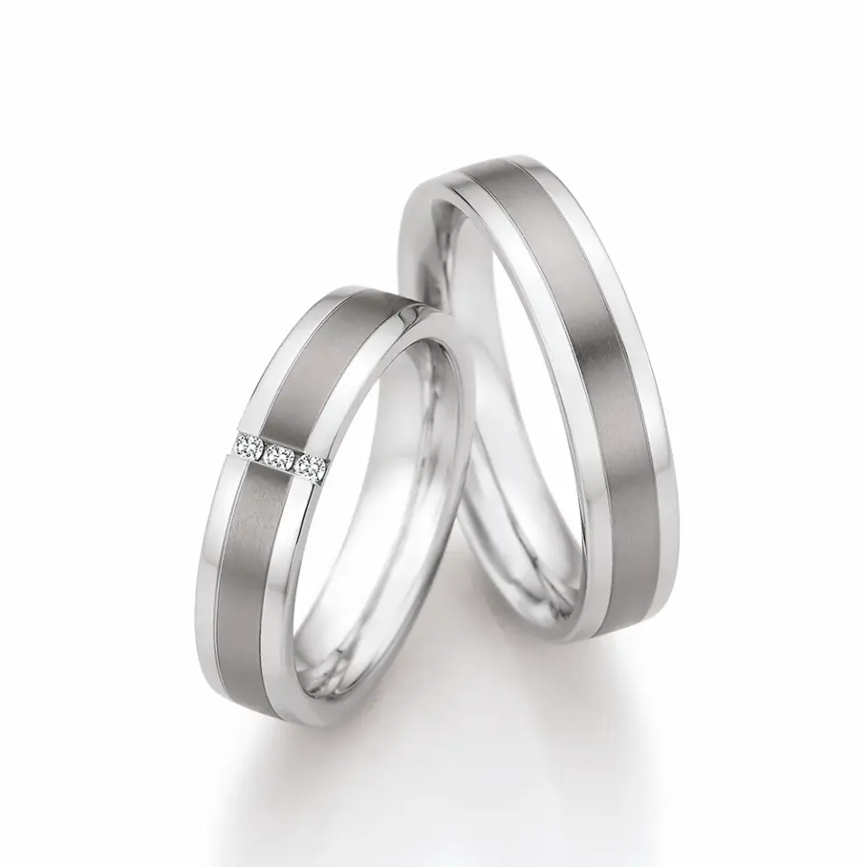 Alianzas de boda de acero y titanio con diamantes