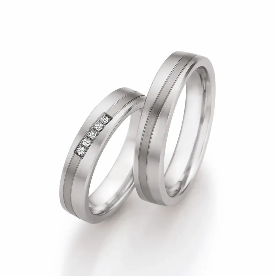 Alianzas de boda de acero y titanio con diamantes