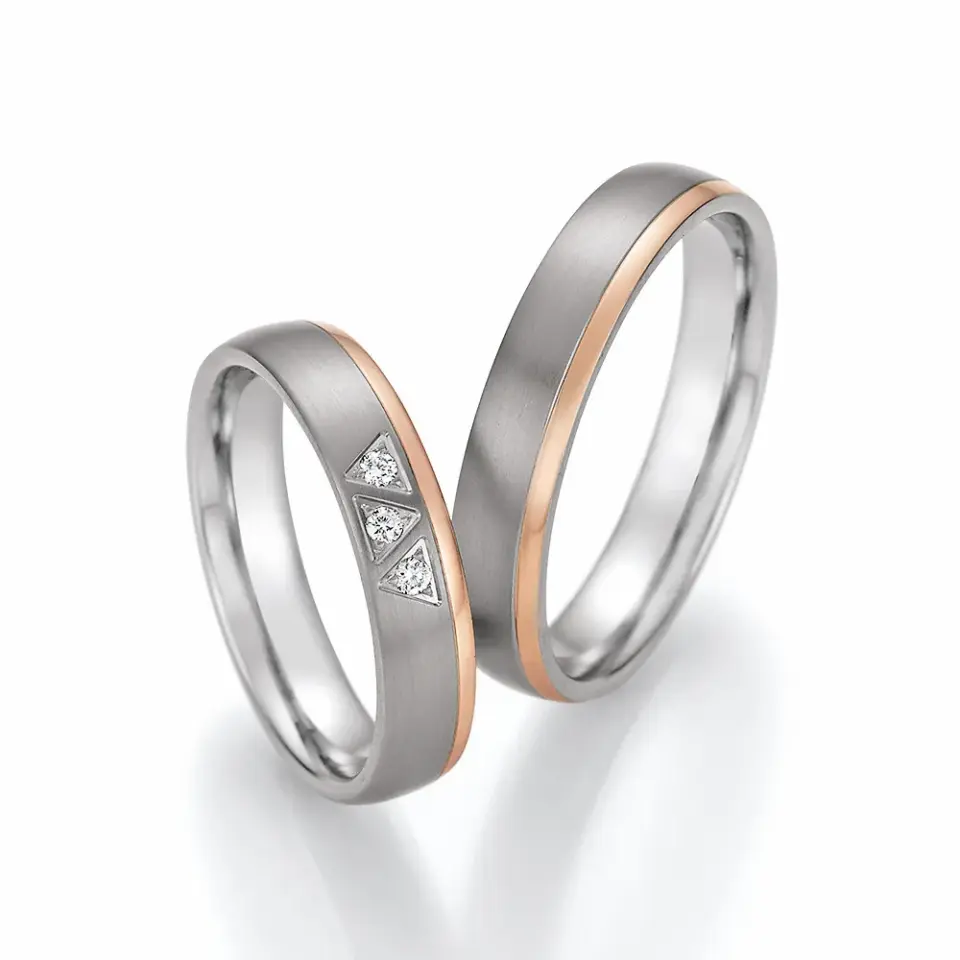Alianzas de boda de titanio y oro rosado con diamantes