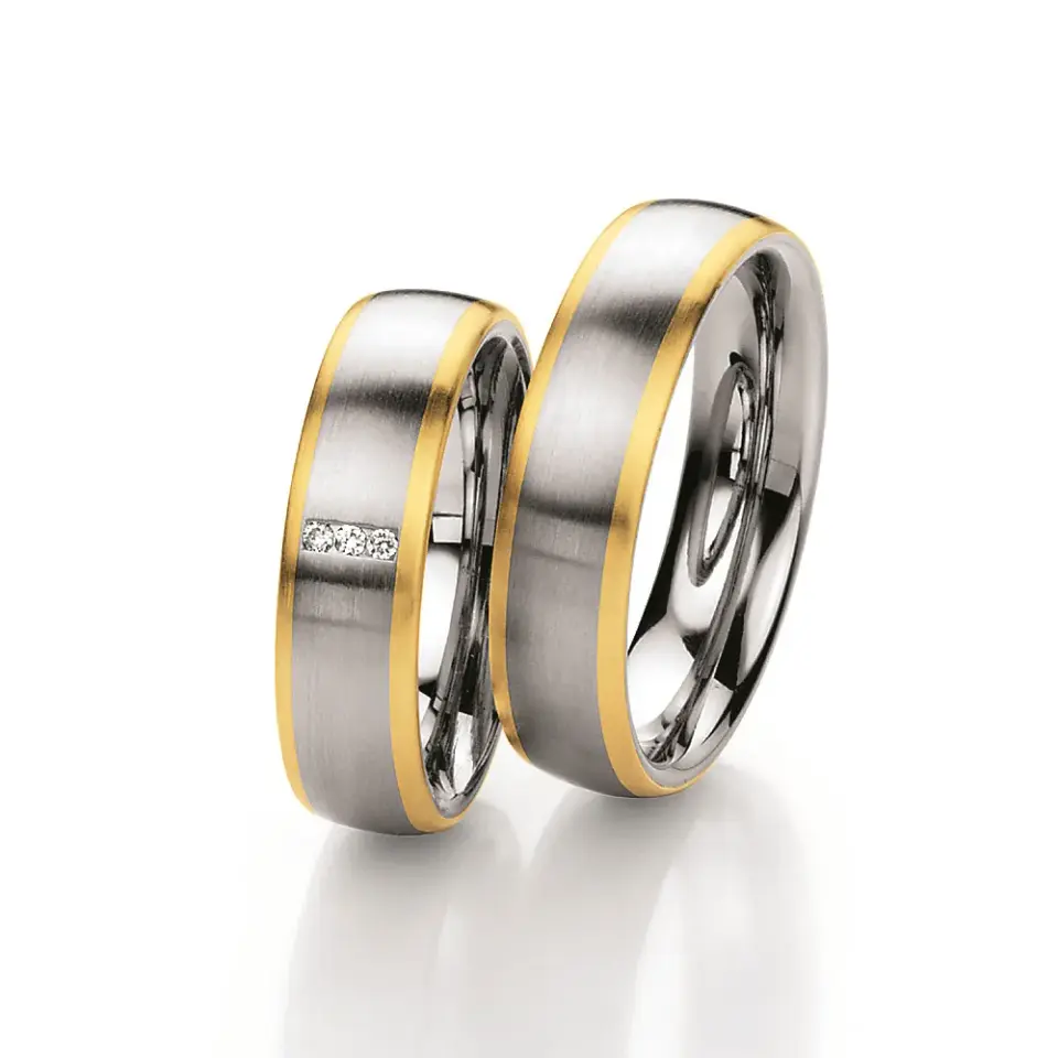 Alianzas de boda de acero y oro amarillo con diamantes
