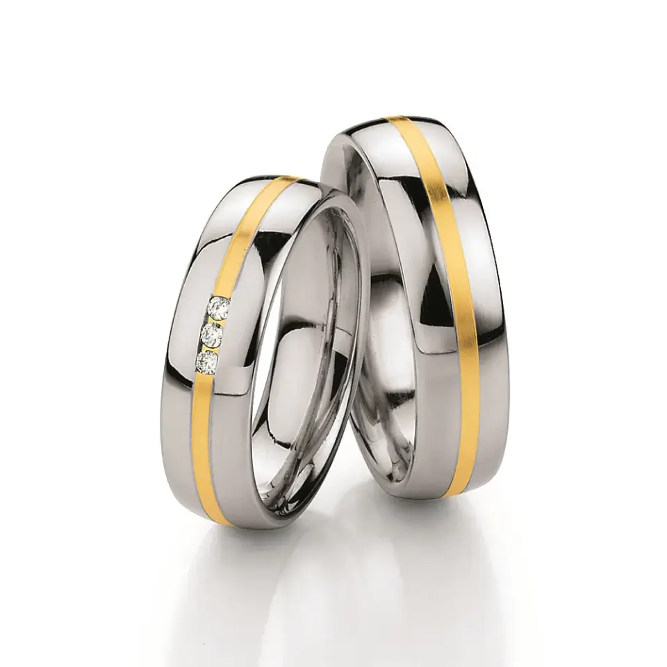 Alianzas de boda de acero y oro amarillo con diamantes
