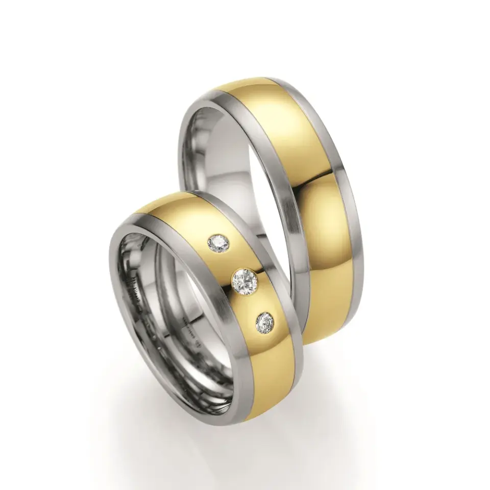 Alianzas de boda de acero y oro amarillo con diamantes