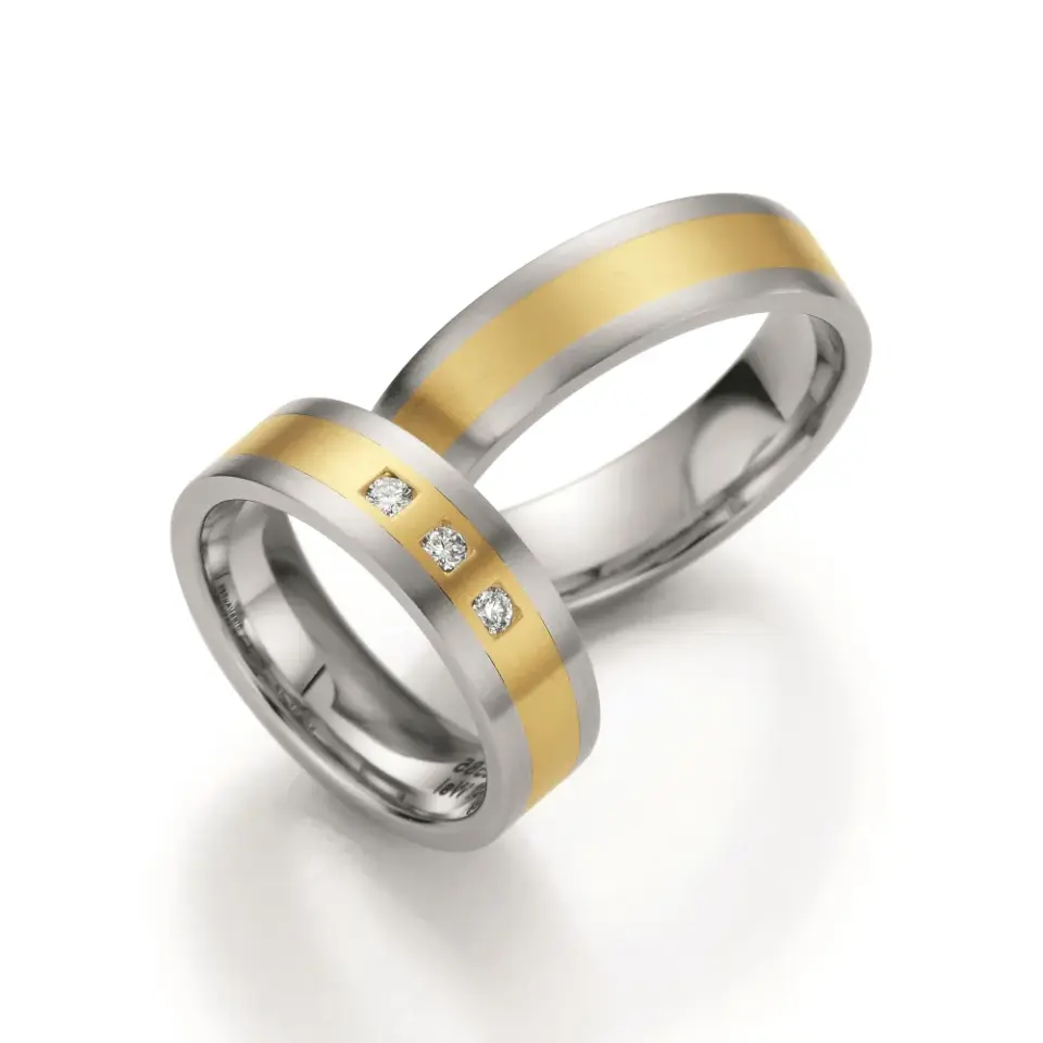 Alianzas de boda de acero y oro amarillo con diamantes