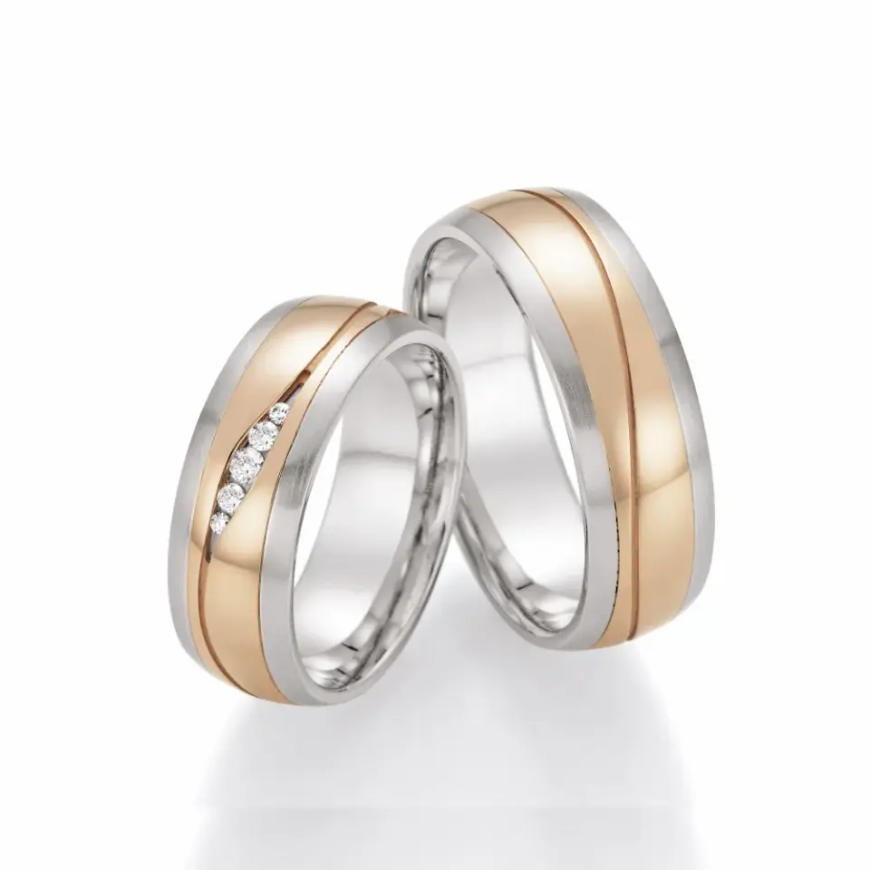 Alianzas de boda de acero y oro rosado con diamantes
