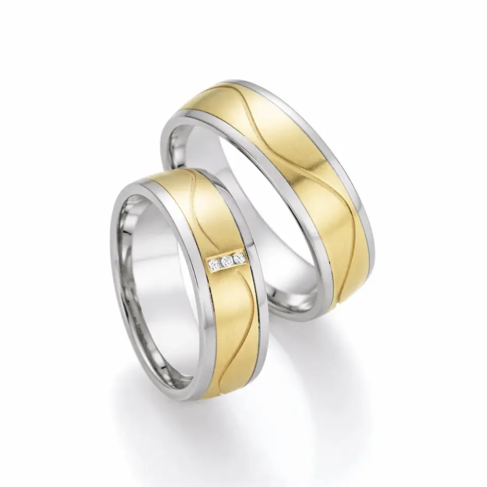 Alianzas de boda de acero y oro amarillo con diamantes