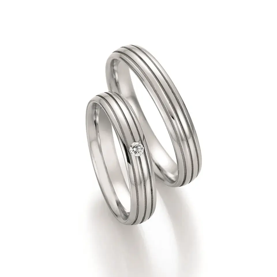 Alianzas de boda de acero con diamante