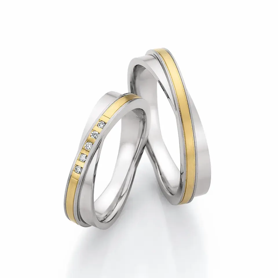 Alianzas de boda de acero y oro amarillo con diamantes