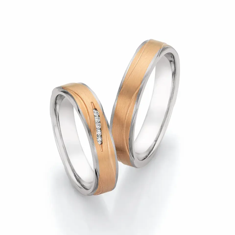 Alianzas de boda de acero y oro rosado con diamantes
