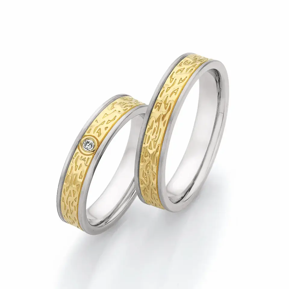 Alianzas de boda de acero y oro amarillo con diamante