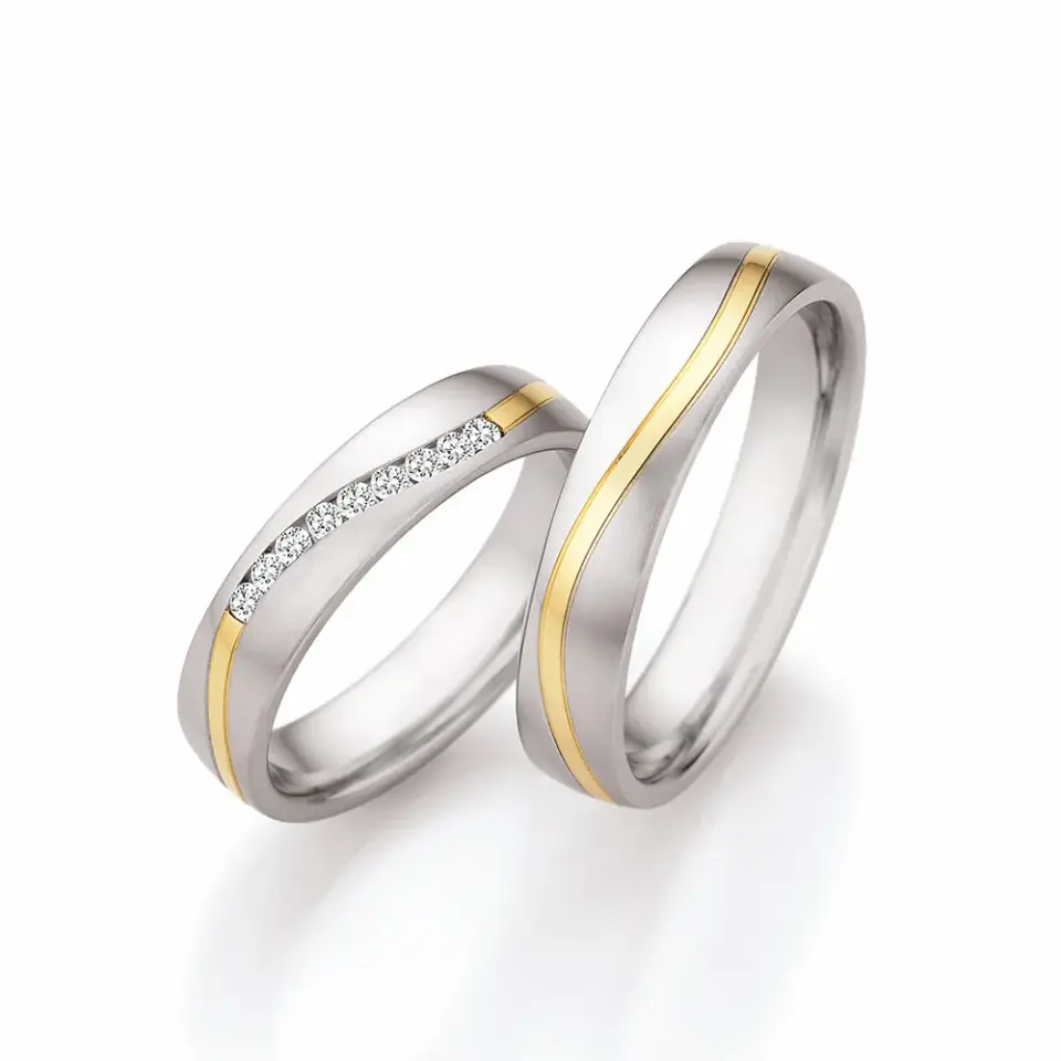 Alianzas de boda de acero y oro amarillo con diamantes