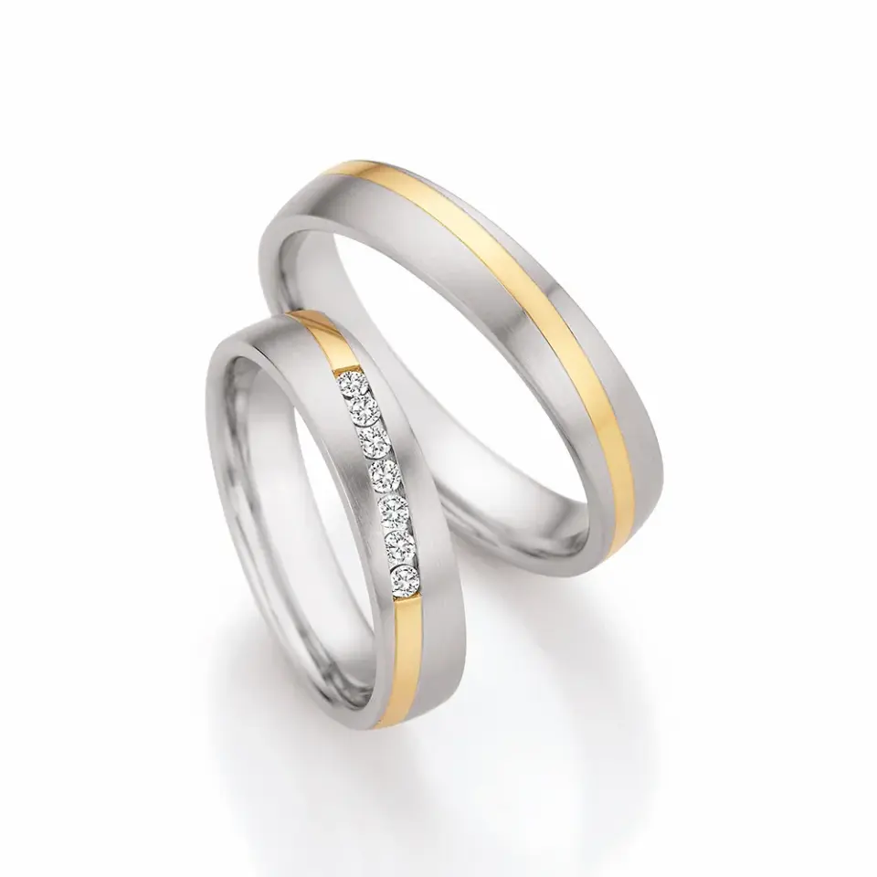 Alianzas de boda de acero y oro amarillo con diamantes