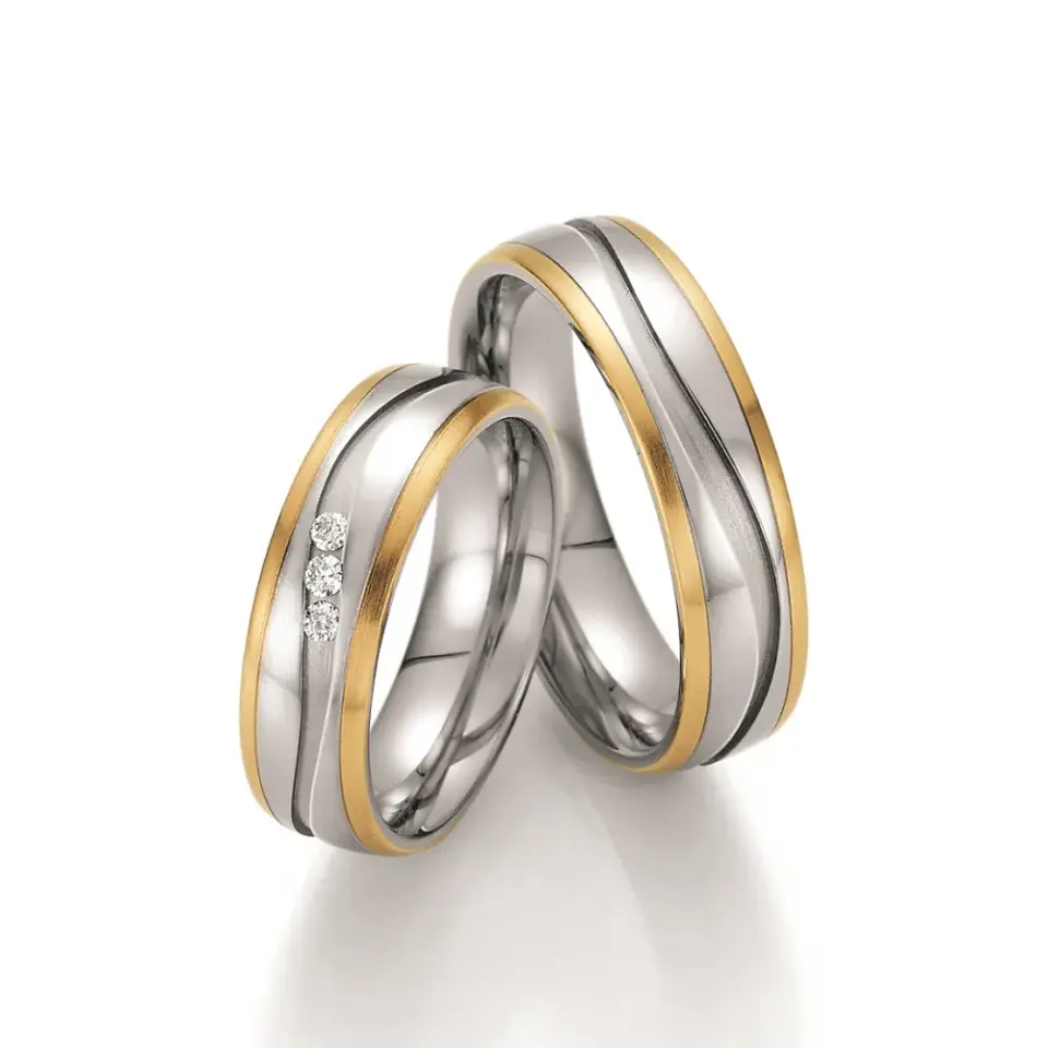 Alianzas de boda de acero y oro amarillo con diamantes