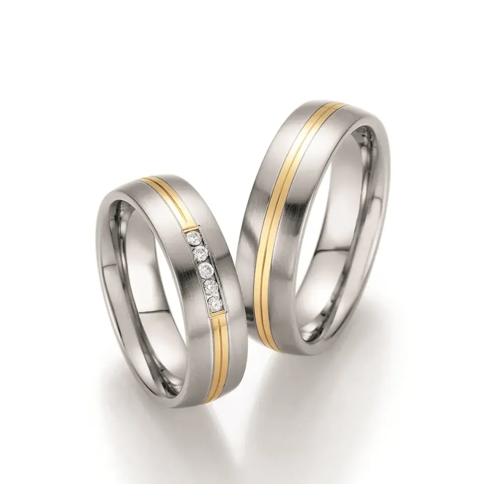 Alianzas de boda de acero y oro amarillo con diamantes