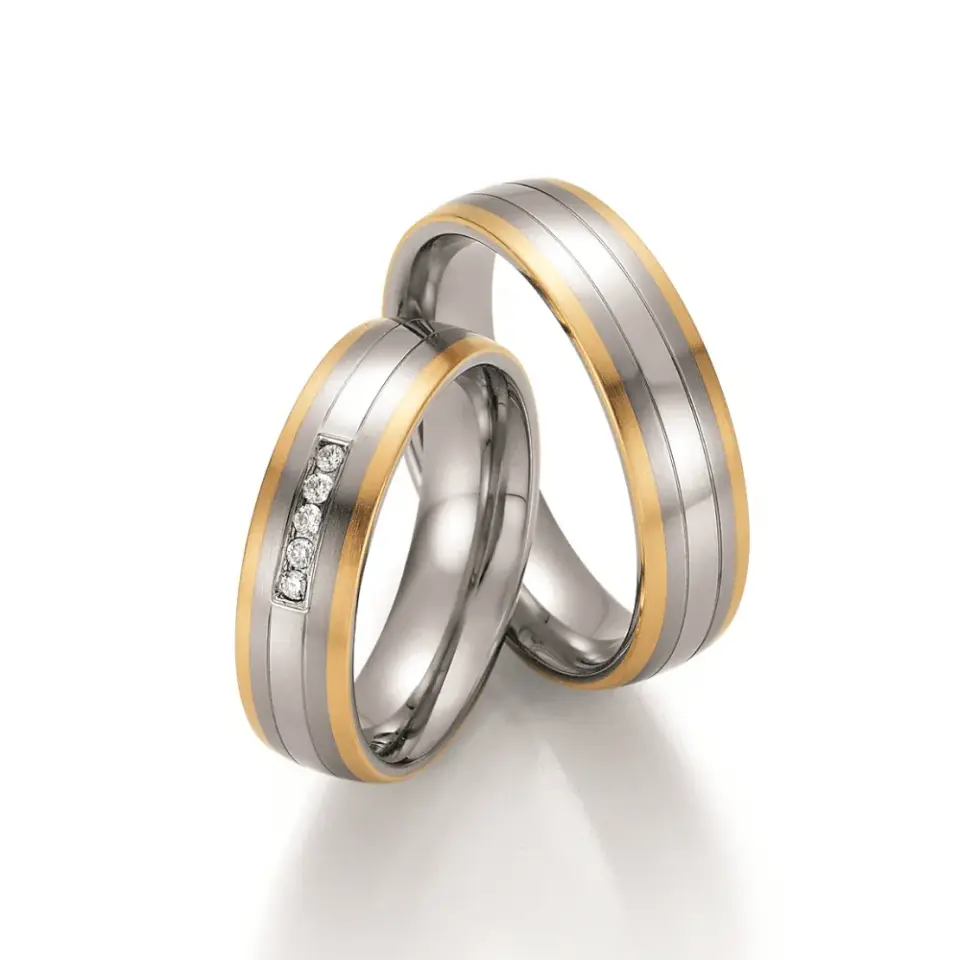 Alianzas de boda de acero y oro amarillo con diamantes