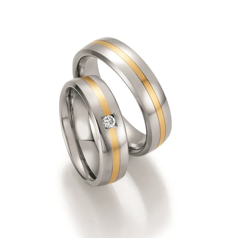 Alianzas de boda de acero y oro amarillo con diamante