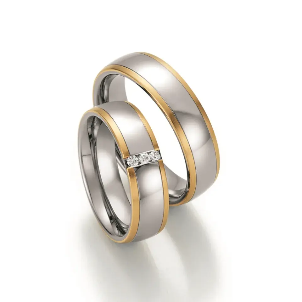 Alianzas de boda de acero y oro amarillo con diamantes
