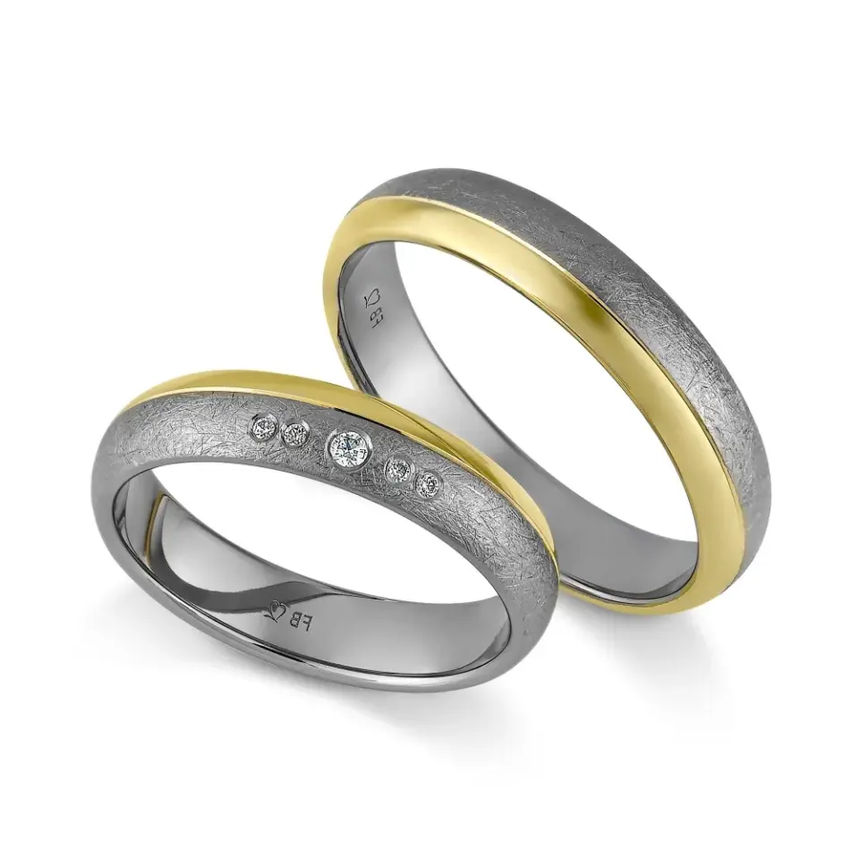 Alianzas de boda de tántalo y oro amarillo con diamantes