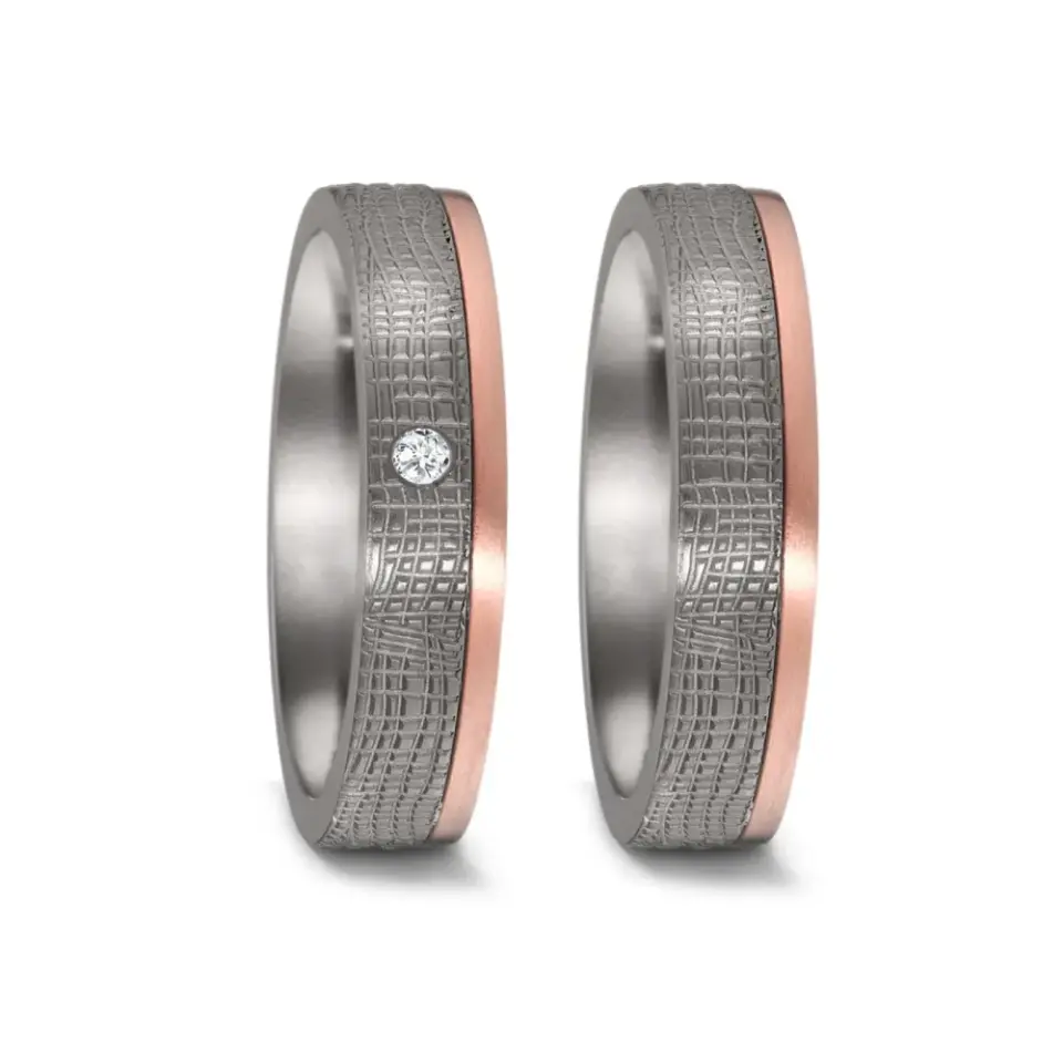Alianzas de boda de tántalo y oro rosado con diamante