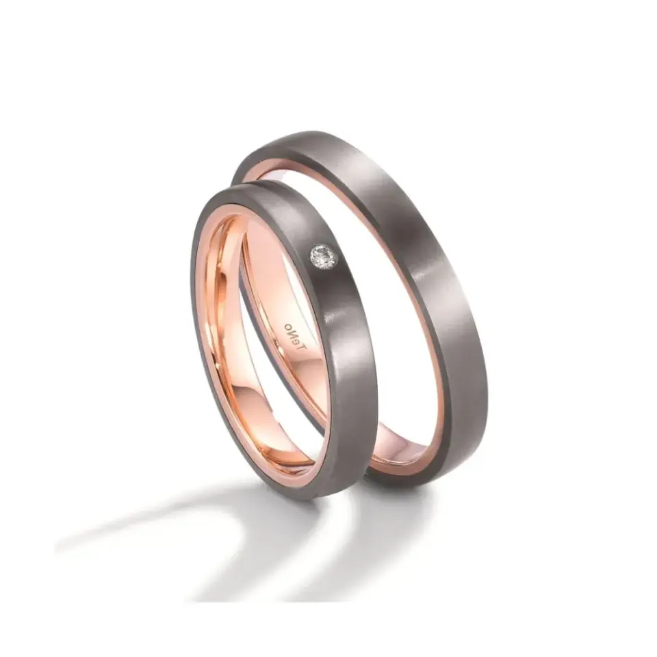 Alianzas de boda de tántalo y oro rosado con diamante