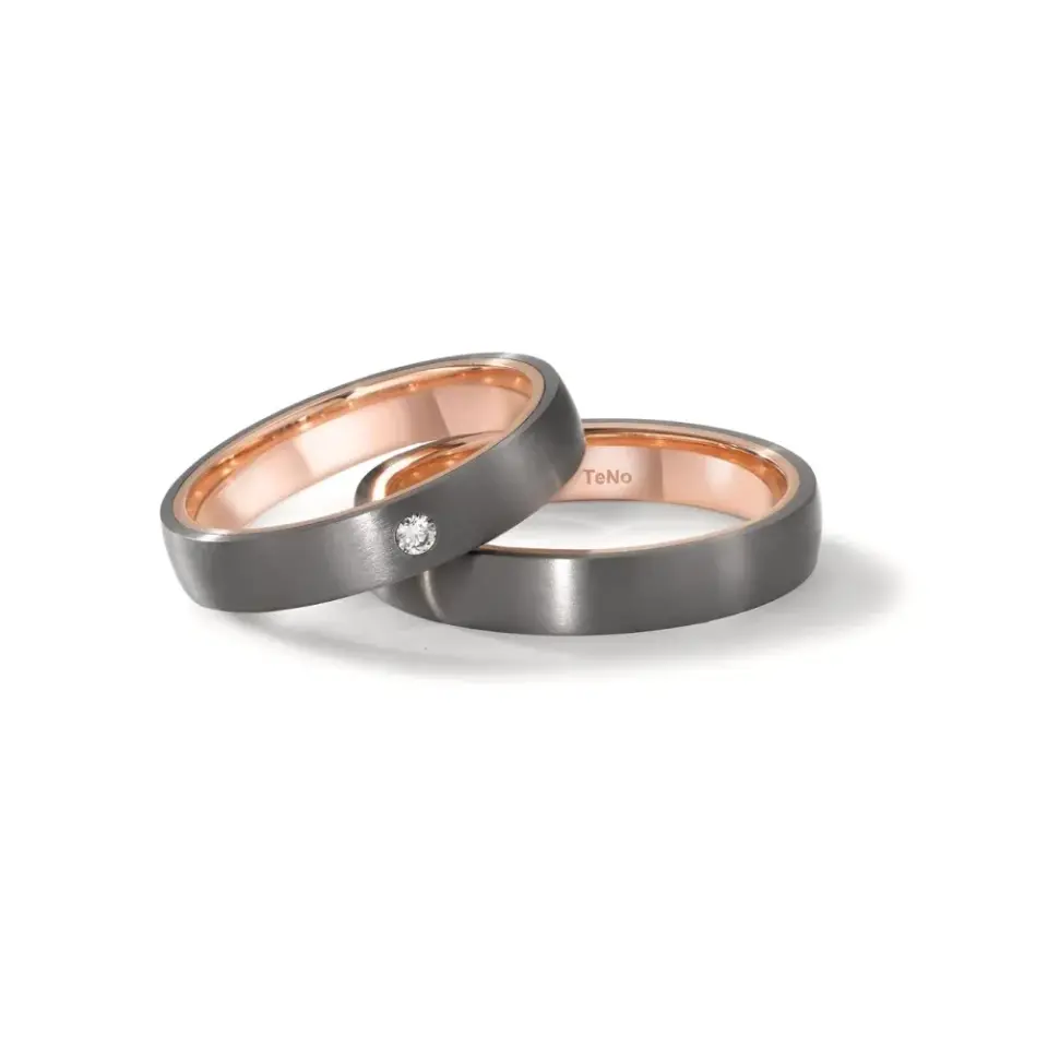 Alianzas de boda de tántalo y oro rosado con diamante