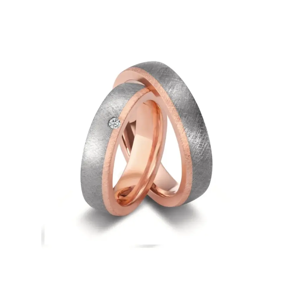 Alianzas de boda de tántalo y oro rosado con diamante