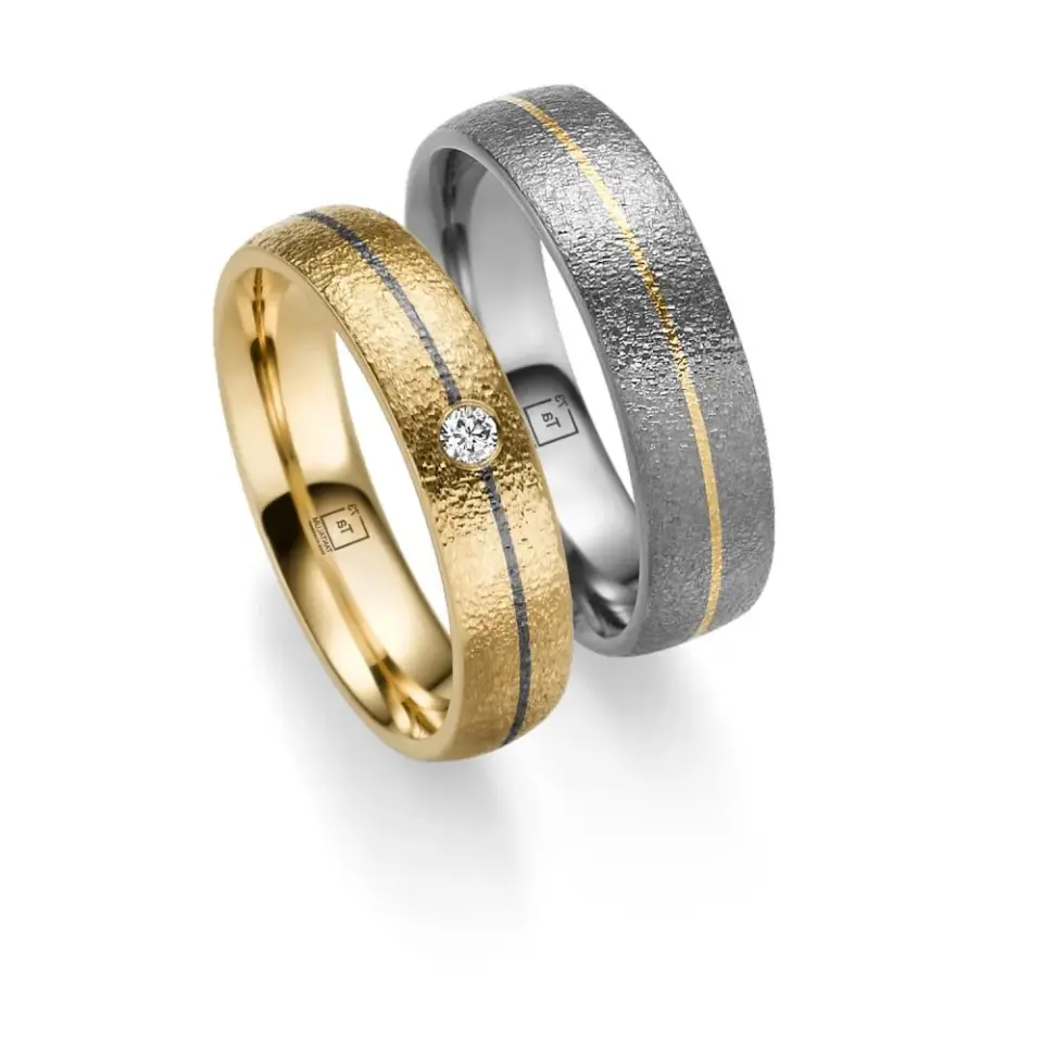 Alianzas de boda de tántalo y oro amarillo con diamante