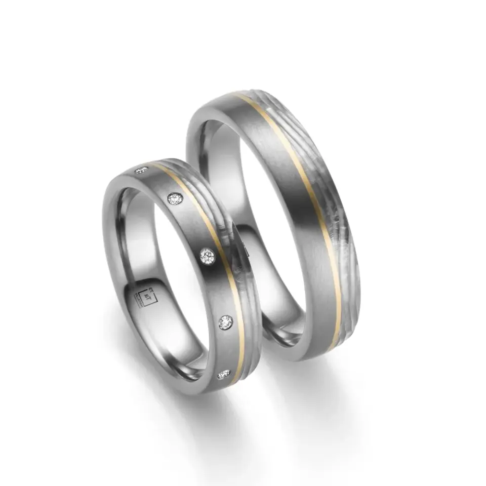 Alianzas de boda de tántalo y oro amarillo con diamantes